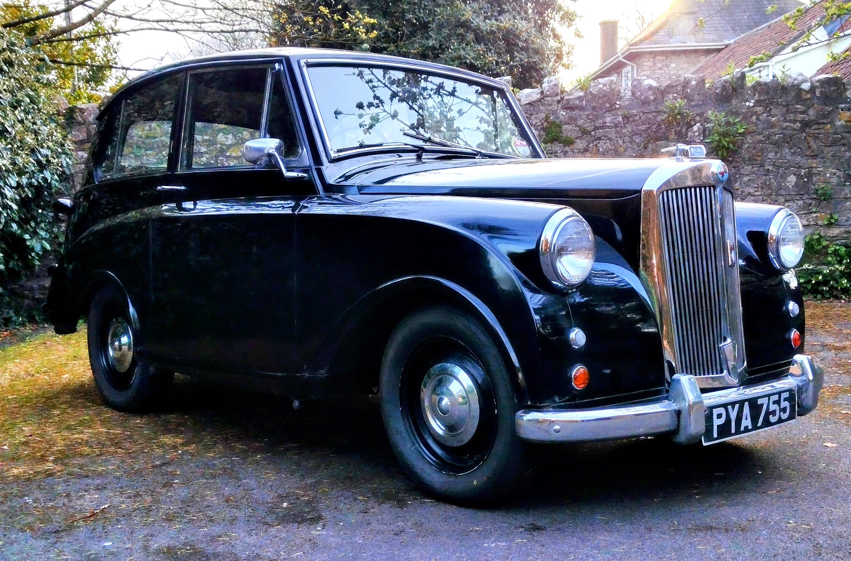 A black Triumph Mayflower classic car.